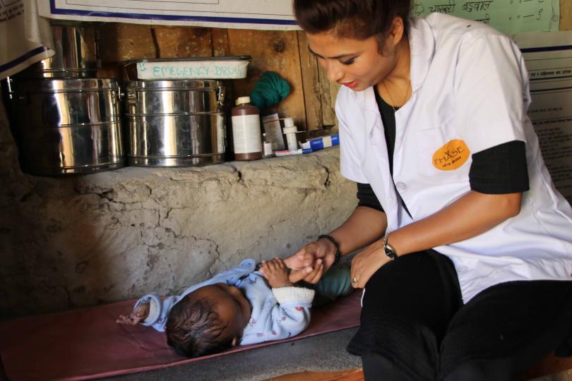 Tharpa: Midwife with newborn