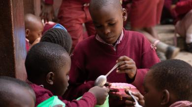 School children distributing nutritious meals